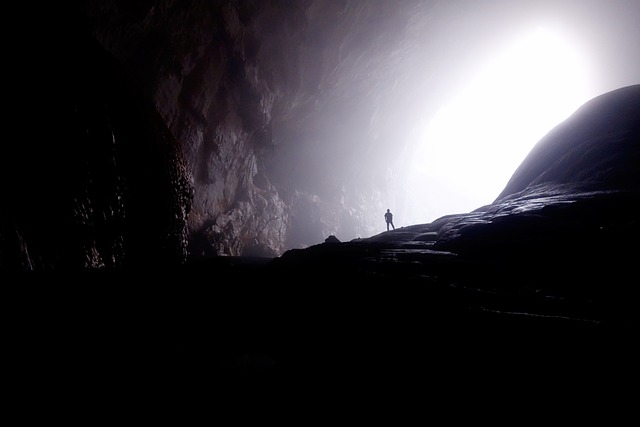 Person exploring a cave